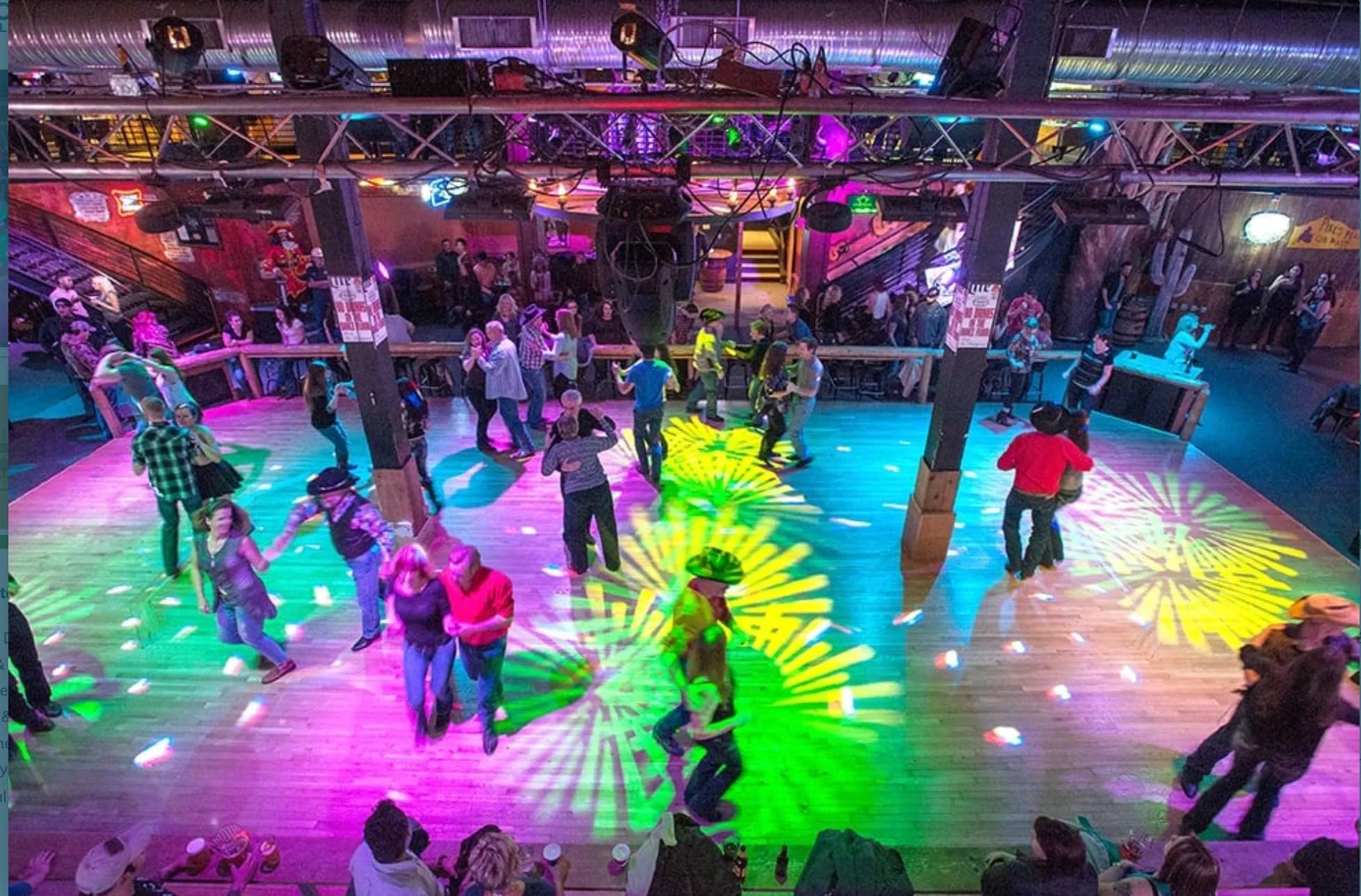 people dancing on colorful dance floor
