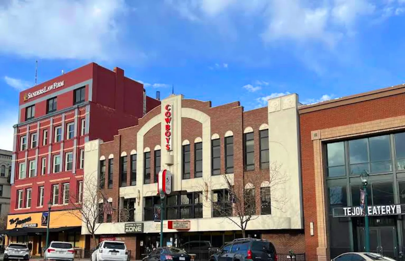 exterior of colorado springs downtown sign showing cowboys